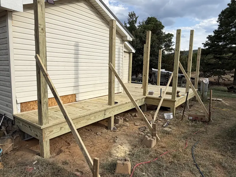 New deck addition being framed onto an existing home