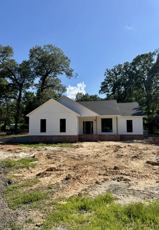 Front elevation of the farmhouse with covered porch