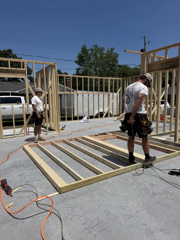 Framers building a wall section