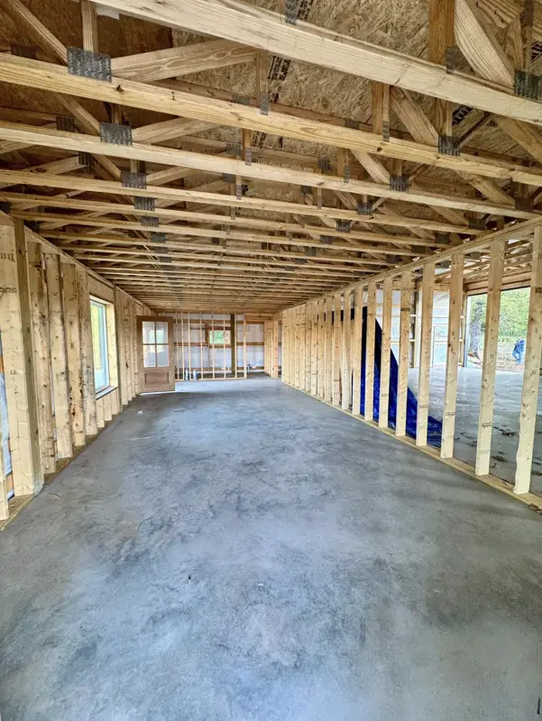 Framed room on a slab with the roof open to the sky