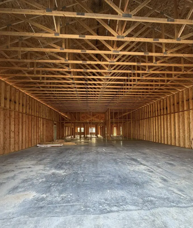 Trusses set inside a framed shop building