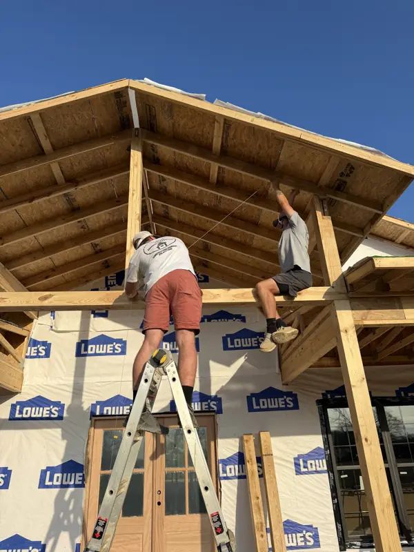Crew framing the porch roof