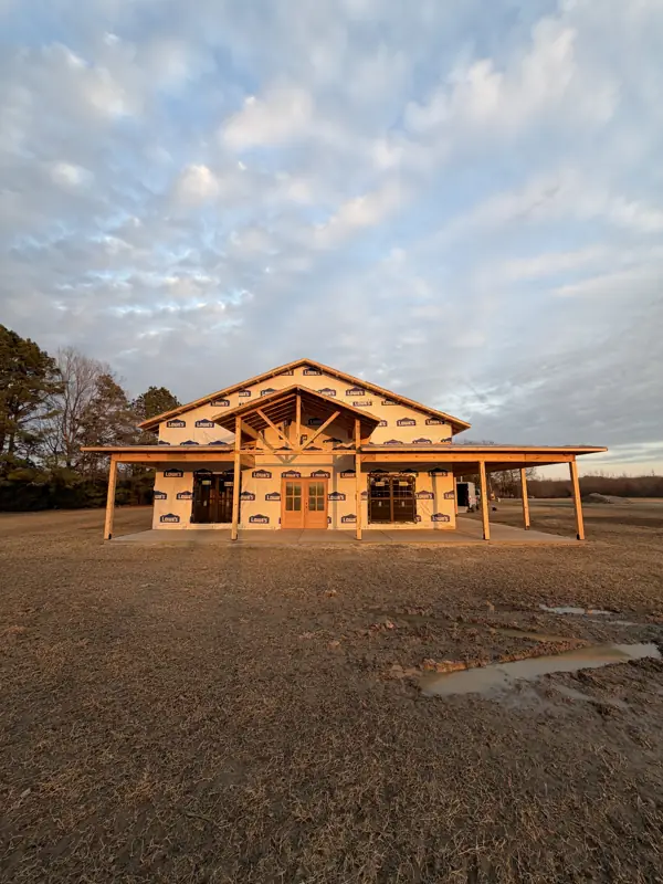 Timber-frame porch home at sunset
