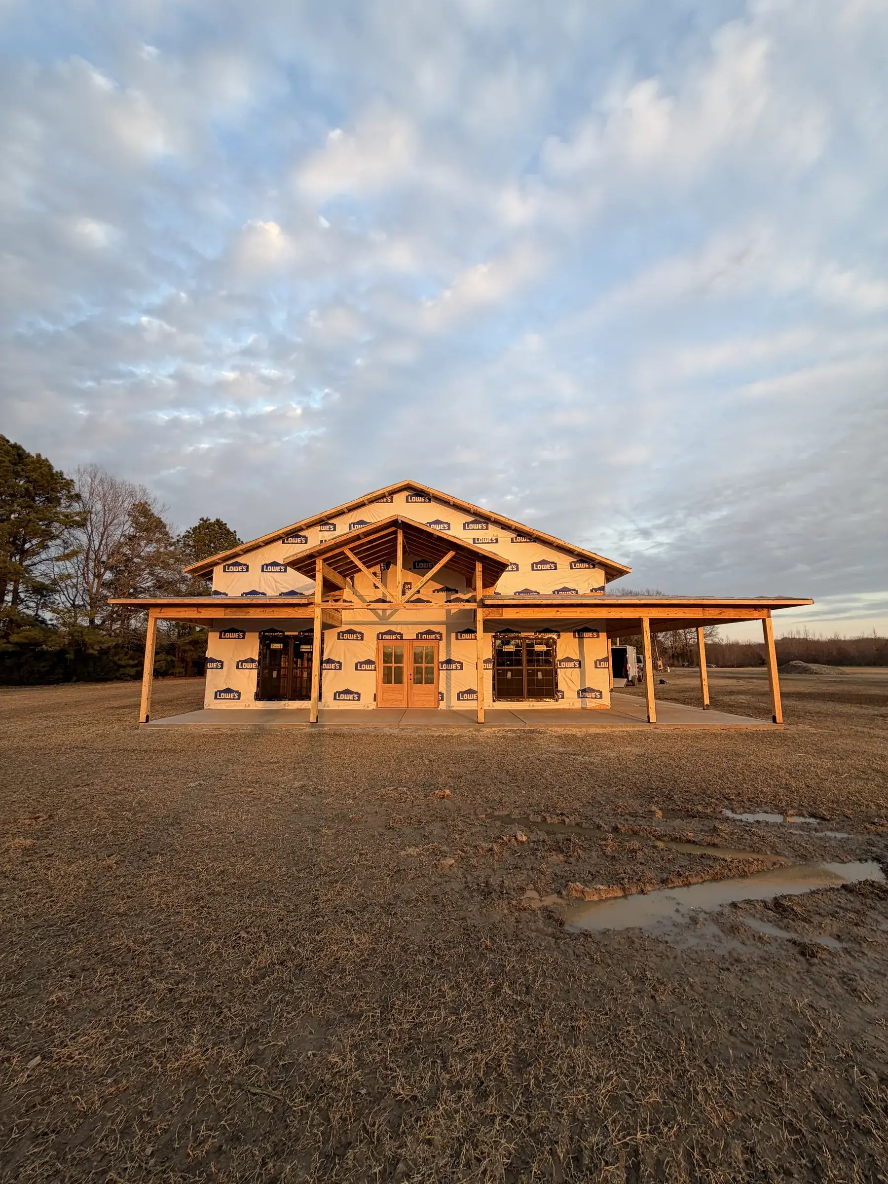 Timber-frame porch on a new home at sunset
